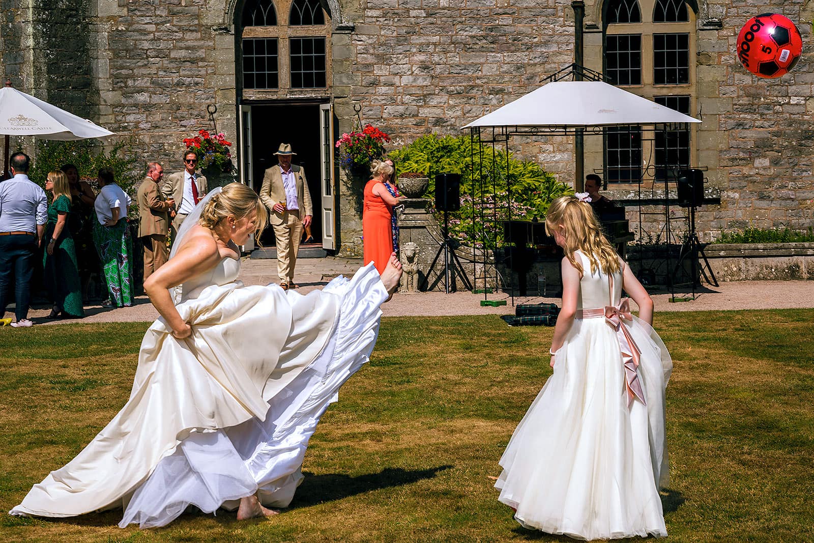 Bride playing football at Clearwell Castle